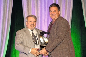  Dominic Girotti (left), the 2014 Robert E. Yoakum Award winner, presented the 2015 award to Chuck Babbert, president of sales at E.C. Babbert Inc. 